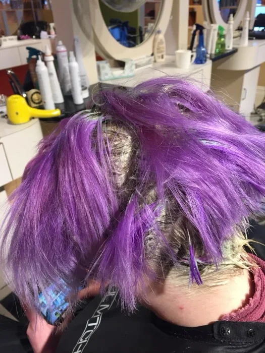 Vivid purple creative color treatment at Creative Cuts Plus