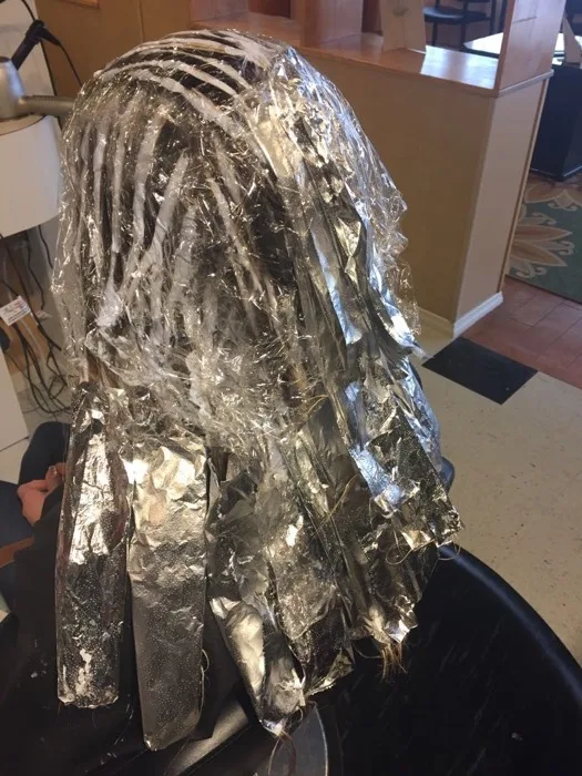Foil highlights color service in progress at Creative Cuts Plus